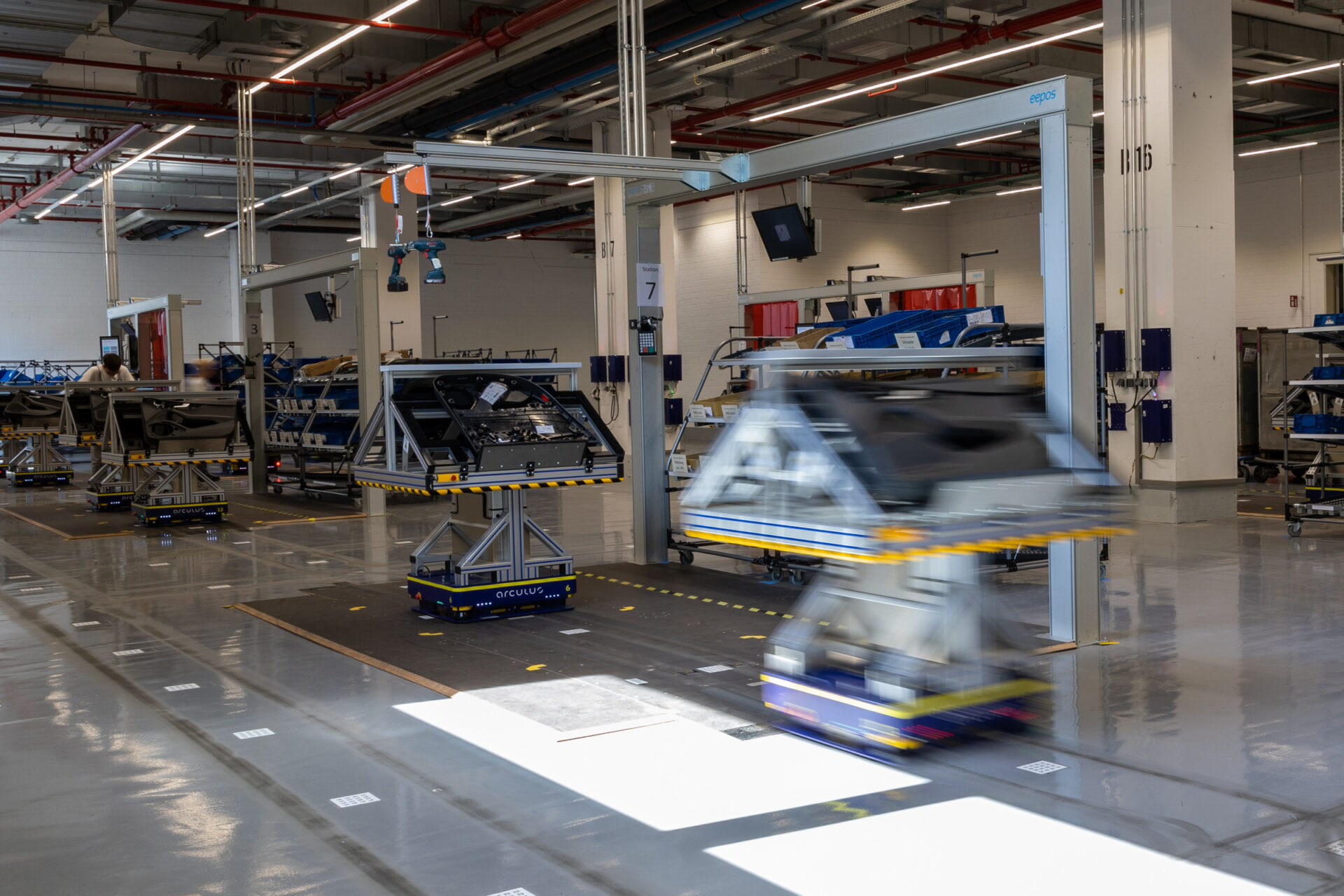 Two arculees transporting Audi car doors at a modular production system in an Ingolstadt factory