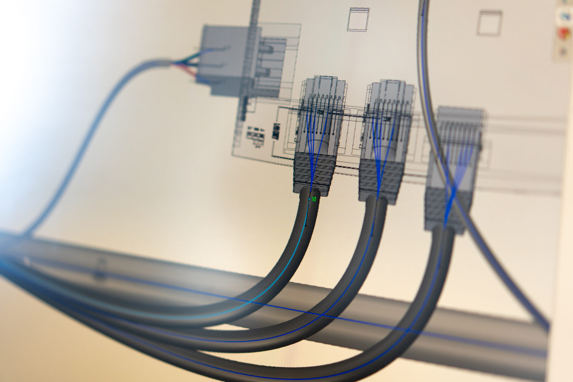 Close-up 3D visualisation of the arculee’s harness design. It includes 3 cables that emerge from the bottom of the screen.