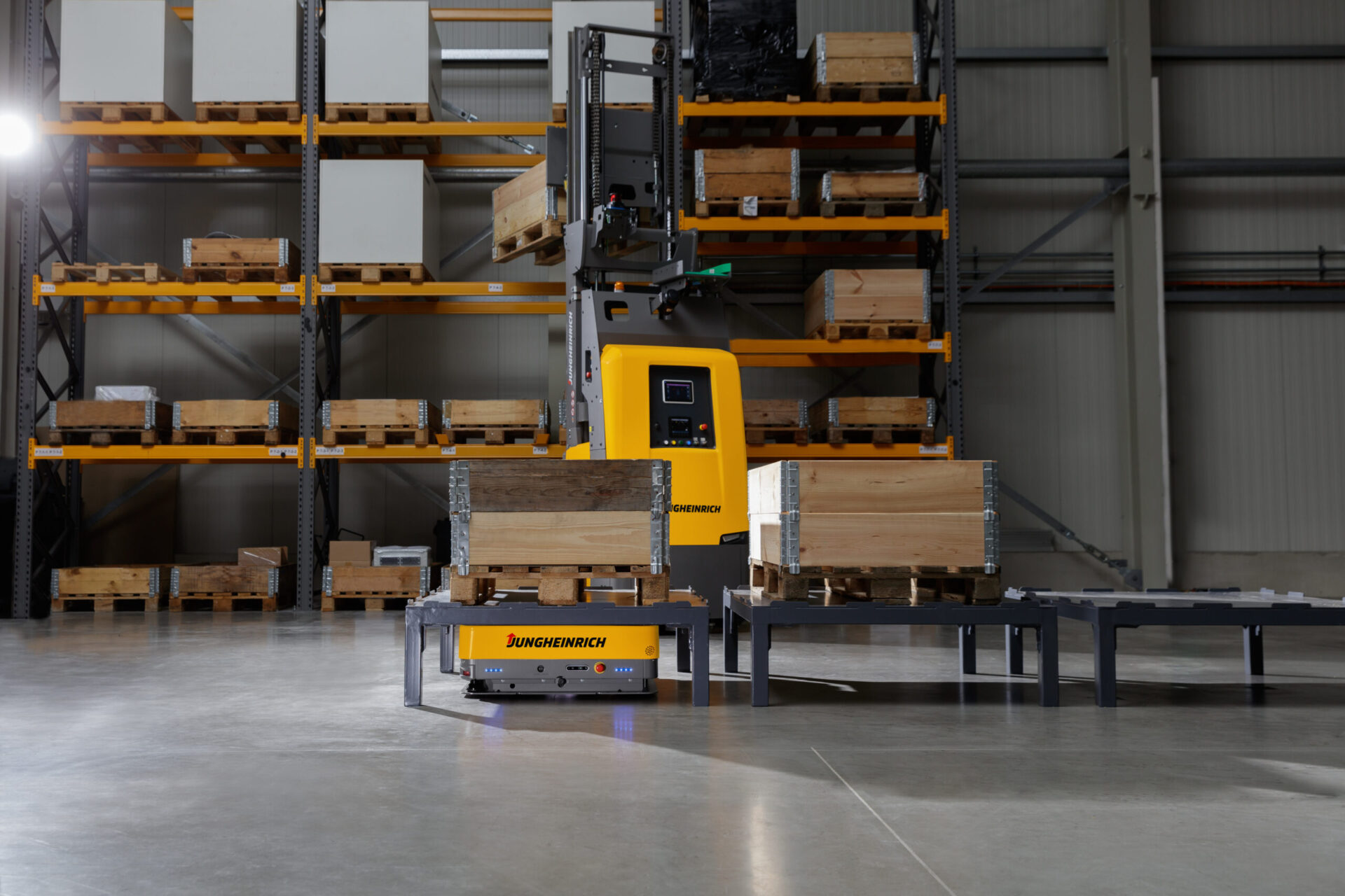 Jungheinrich Mobile Robots standing in a warehouse 