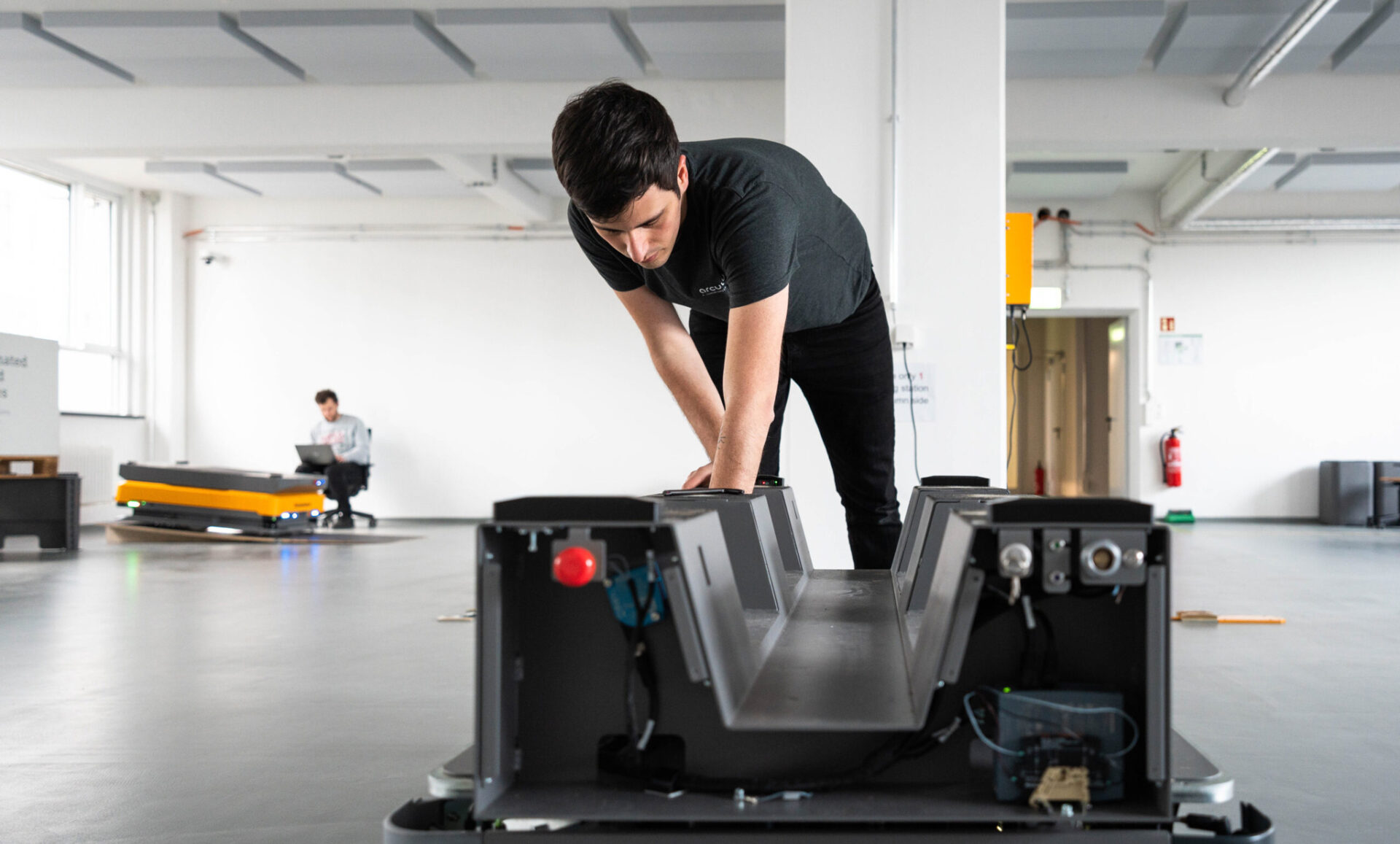 One of our engineers working on the arculee M AMR backpack in our modern test area. 